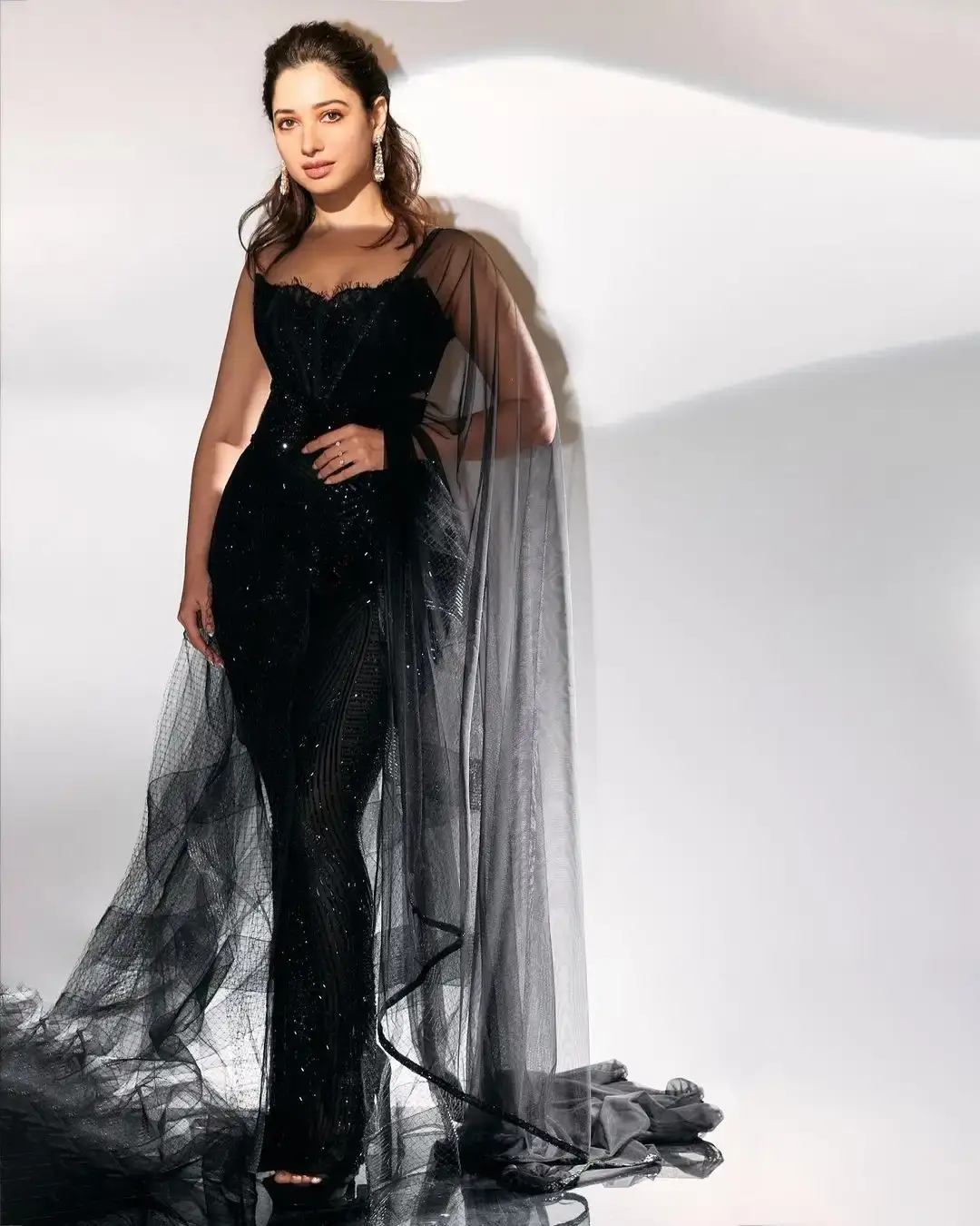 TAMANNAAH BHATIA STUNNING LOOKS IN LONG SLEEVELESS BLACK GOWN 4